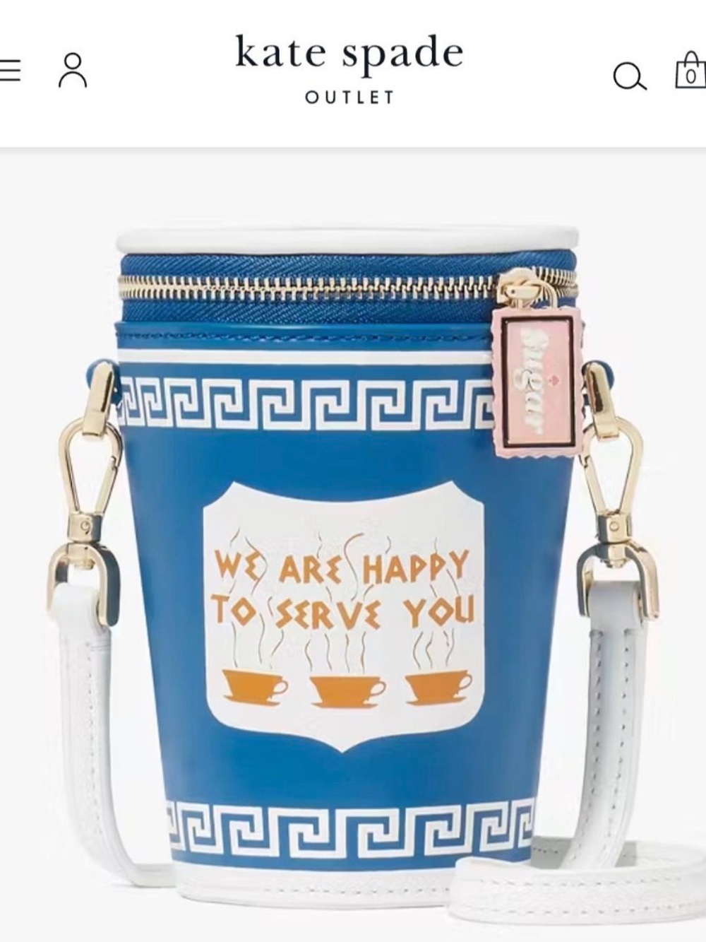 kate spade blue cup-shaped crossbody with white trim and pink charm